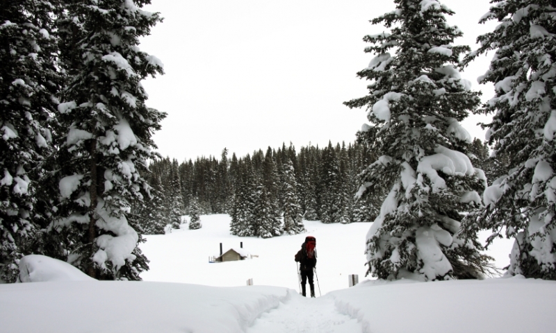 Skier approaches Hut on Vail Pass