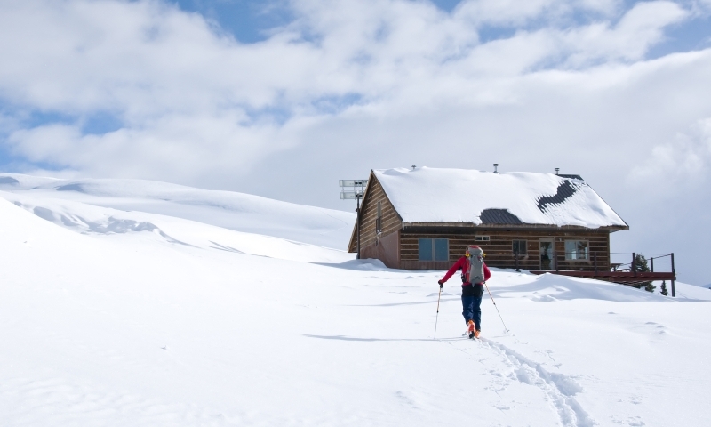 Backcountry Skier approaches Winter Hut