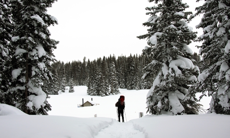 Skier approaches Hut on Vail Pass