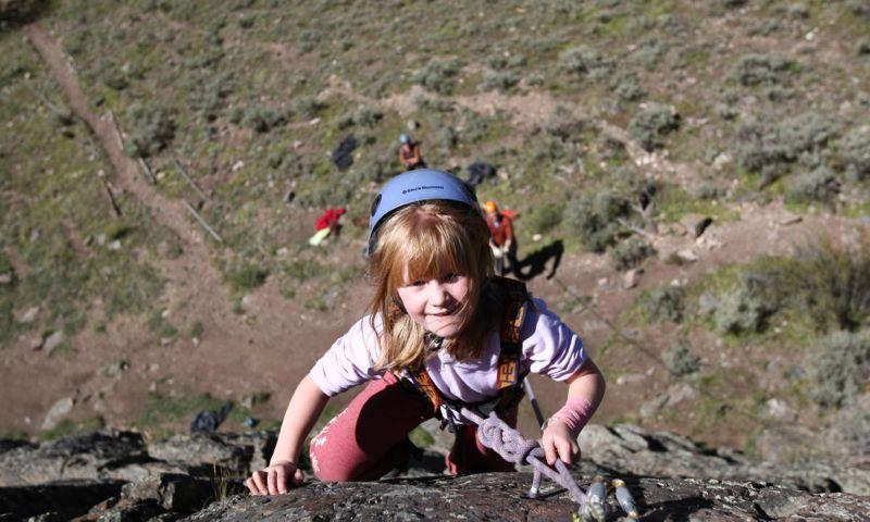 Kid climbing with Apex Mountain School