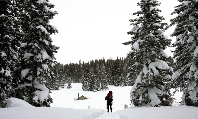 Skier approaches Hut on Vail Pass
